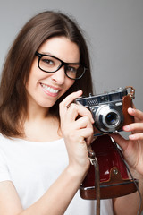 retro photographer girl holding camera