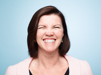 mature woman pulling funny faces
