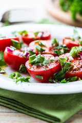 Close up of tomato salad with fresh herbs