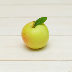 Apple fruit on white wooden background