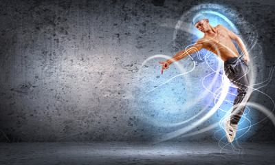 Fototapeta premium young man dancing hip hop with color lines