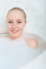 Bath woman enjoying bahub. Naturaly beautiful female relaxing