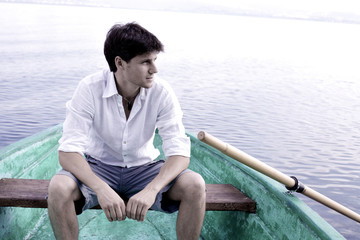 Handsome happy man on boat