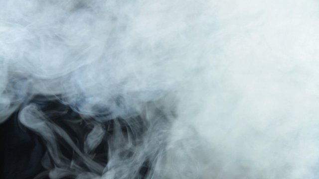 Thick smoke on black background