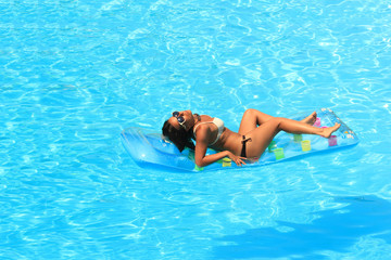 Woman Relaxing in a pool