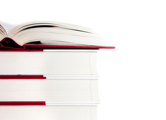 Open book on a stack of books