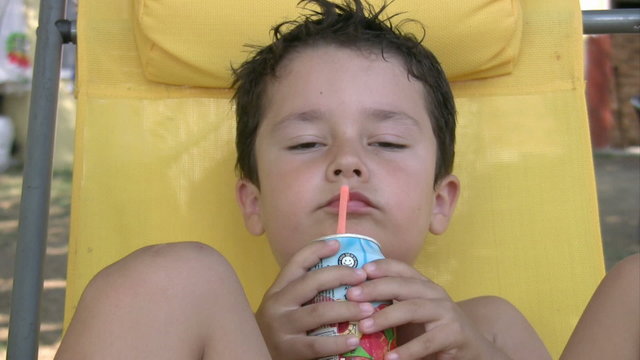 Little boy drinking  juice
