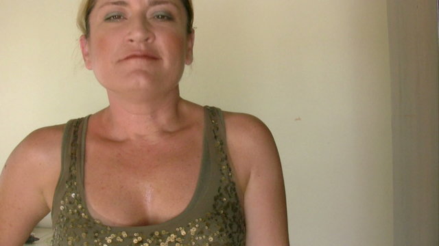 Woman applying parfume
