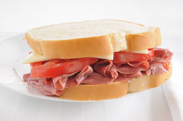 Pastrami sandwich on a white background