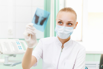 Female doctor with X-ray