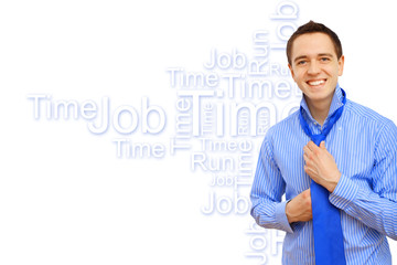 Young business man binding his blue tie