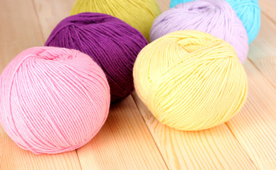 Knitting yarn on wooden background