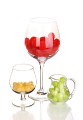 Color candies in glasses isolated on white