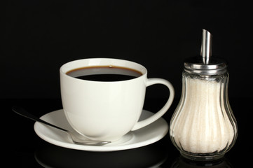 sugar bowl with cup of coffee isolated