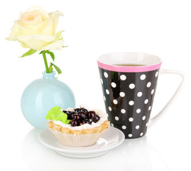 sweet cake with cup of tea isolated on white