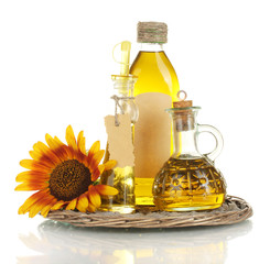 oil in jars and sunflower, isolated on white