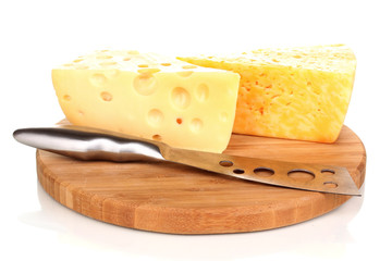 tasty cheese and knife on wooden board isolated on white