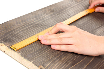 measuring wooden board close-up