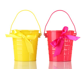 Colorful buckets isolated on white