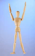 wooden mannequin, on blue background