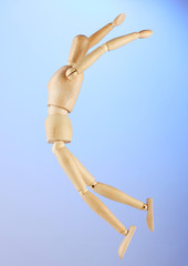 wooden mannequin, on blue background