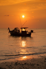 Fishing boat and sunset