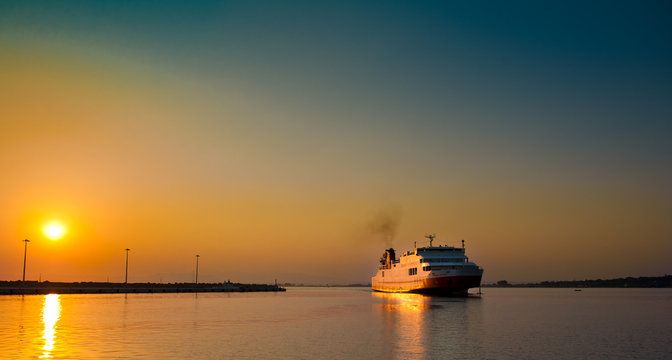 view of passenger ferry boat in open waters in Greece at sunrise