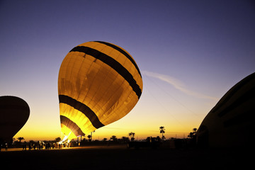 hot air balloon is inflating before liftoff - Powered by Adobe