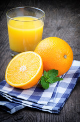 Glass of orange juice and fresh fruits