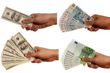 Dollar, euro and rouble bills in a hand