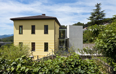 yellow house surrounded by nature
