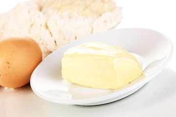 Eggs, flour and butter close-up isolated on white