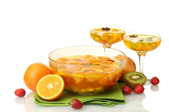 punch in bowl and glasses with fruits,