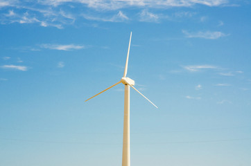 Wind mill on the bright summer day