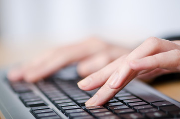 Hands typing on the keyboard