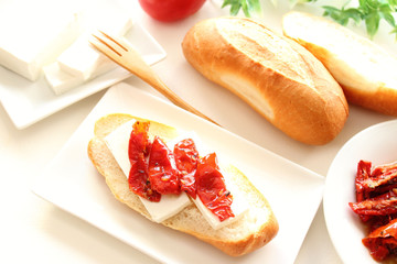Dried tomatoes and feta cheese open sandwich brunch