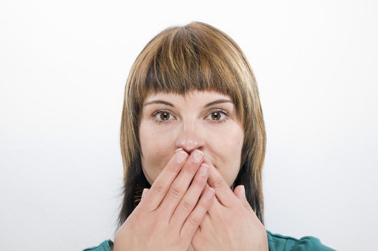 both of hand on the mouth