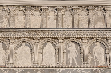 Renaissance facade, pilasters, arches, frescoes,