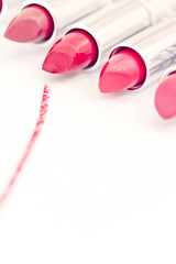 Obraz na płótnie Canvas red pink lipsticks with stroke