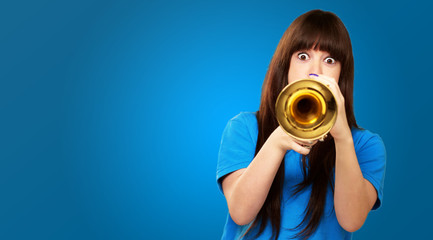 portrait of a teenager playing trumpet © Krakenimages.com