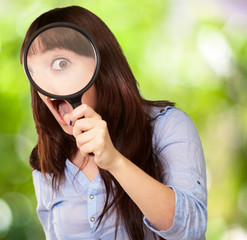 Woman Holding Magnifying Glass