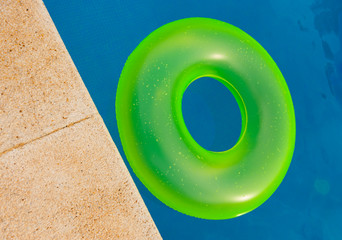 Bright floater on the pool