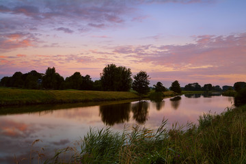 Fototapeta na wymiar sunrise on river in Groningen