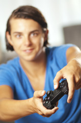 Teenage boy is playing a videogame