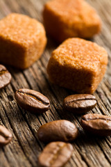 coffee beans with brown sugar cubes