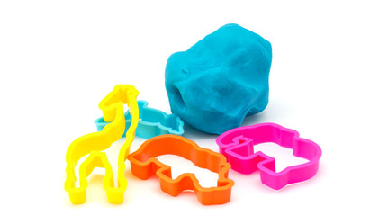 Colourful molding dough and cutters for children isolated on whi