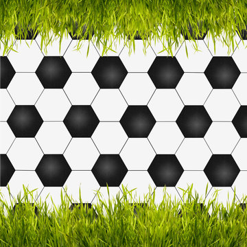 A soccer ball with green grass as creative background