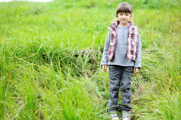 Autumn portrait of a child girl in warm jacket