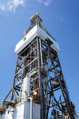 Derrick of Offshore Jack Up Drilling Oil Rig On Sunny Day