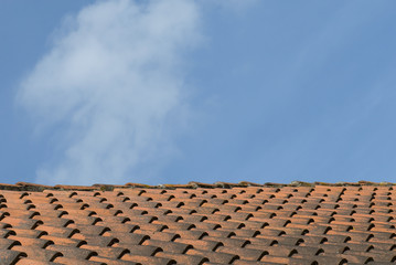 Old clay roof tiles with blue sky, Ribe, Denmark.